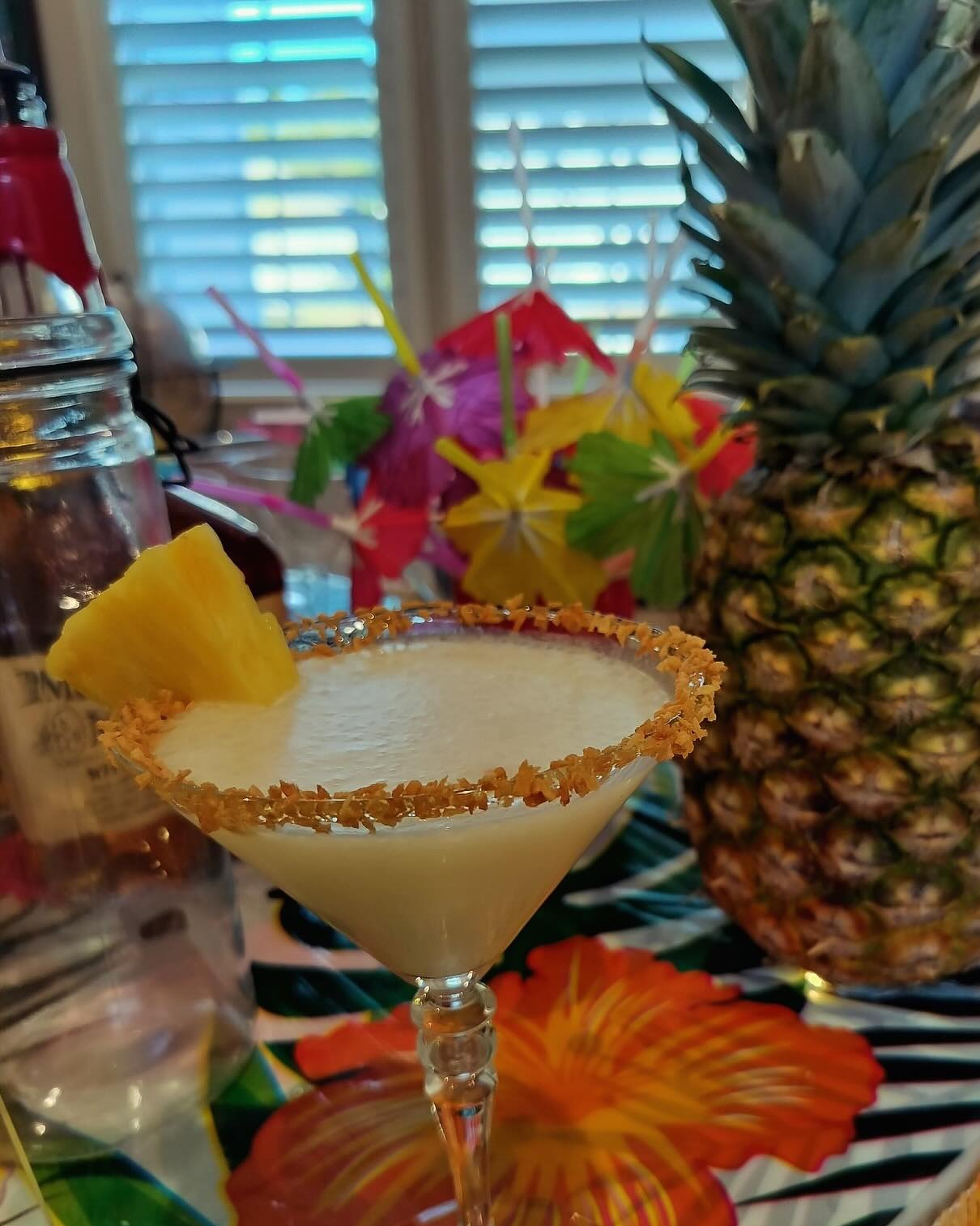 Piña colada with a toasted-coconut rim and fresh pineapple garnish